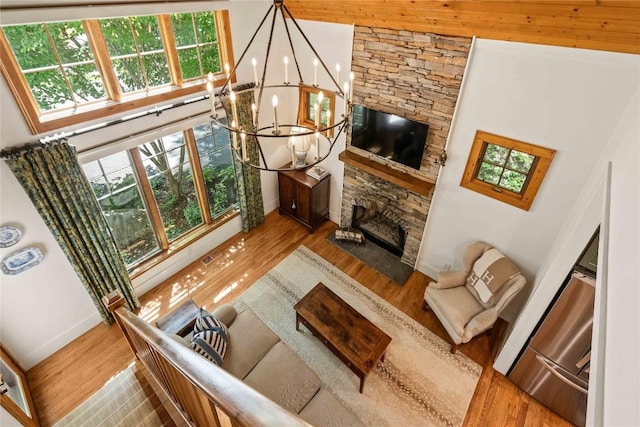 60 Glassy Vw, Cashiers, NC 28717 - living area with a high ceiling, healthy amount of natural light, a chandelier, wood finished floors, and baseboards