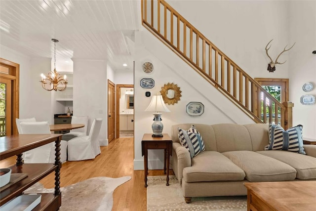 60 Glassy Vw, Cashiers, NC 28717 - living area featuring plenty of natural light, a chandelier, light wood-type flooring, stairs, and recessed lighting