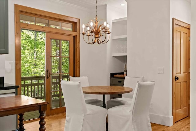 60 Glassy Vw, Cashiers, NC 28717 - dining room with a chandelier, light wood-style floors, crown molding, and baseboards