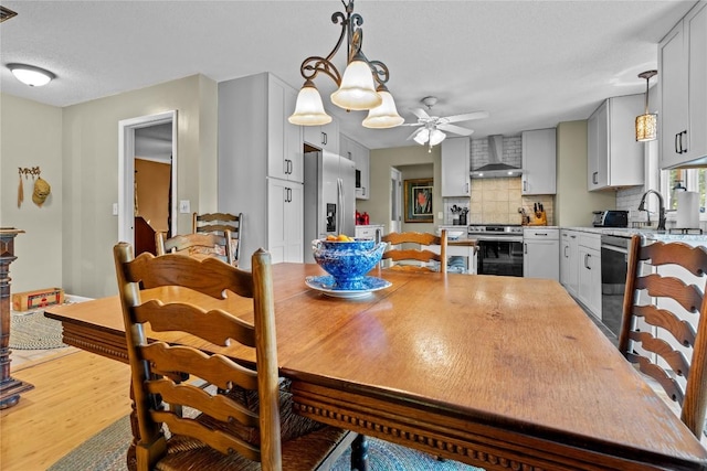 233 Strawberry Hill Rd, Cullowhee, NC 28723 - dining area with a ceiling fan and light wood-type flooring