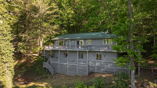 233 Strawberry Hill Rd, Cullowhee, NC 28723 - back of house with stairway, a wooden deck, and a view of trees