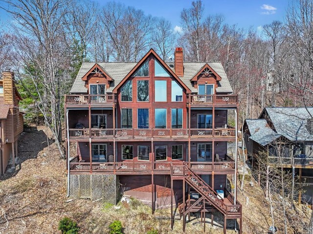 277 Kestrel Ct, Sapphire, NC 28774 - rear view of house with a balcony, a chimney, and a deck