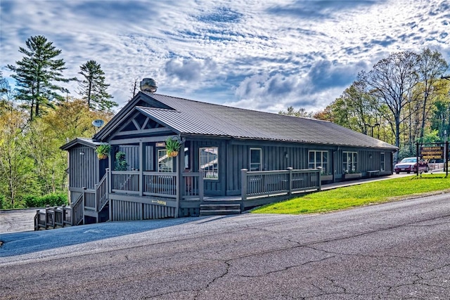 view of front of home with board and batten siding and metal roof