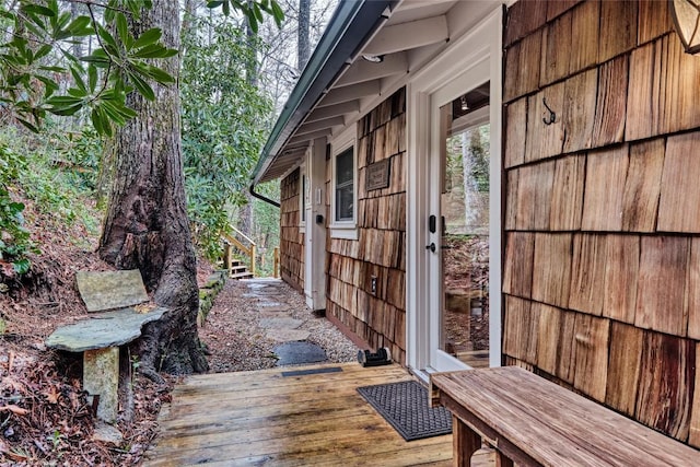 view of property exterior with a wooden deck