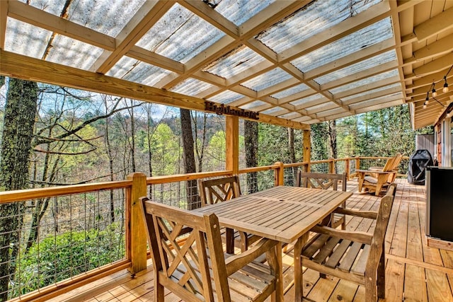 wooden deck with outdoor dining space