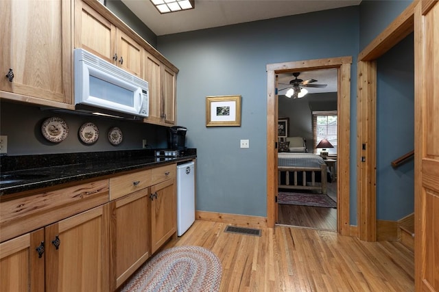 8 Par Path, Cashiers, NC 28717 - kitchen with white microwave, light wood-style floors, a ceiling fan, and dark stone countertops