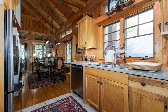 8 Par Path, Cashiers, NC 28717 - kitchen featuring appliances with stainless steel finishes, a wood ceiling with exposed beams, light countertops, a chandelier, and light wood-style flooring
