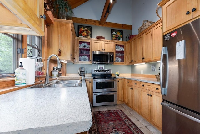 8 Par Path, Cashiers, NC 28717 - kitchen with appliances with stainless steel finishes, light countertops, light tile patterned floors, glass insert cabinets, and high vaulted ceiling