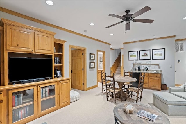 living room with visible vents, light colored carpet, stairway, ornamental molding, and recessed lighting