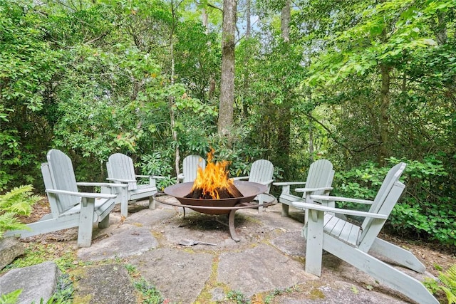 view of patio / terrace with a fire pit