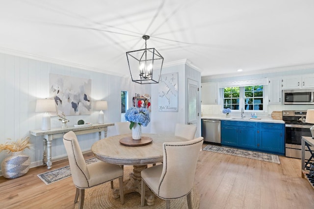 28 Toxaway Pt Unit 7, Lake Toxaway, NC 28747 - dining space featuring ornamental molding, a chandelier, and light wood-style floors
