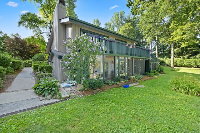 28 Toxaway Pt Unit 7, Lake Toxaway, NC 28747 - rear view of house featuring a lawn, a chimney, and a wooden deck