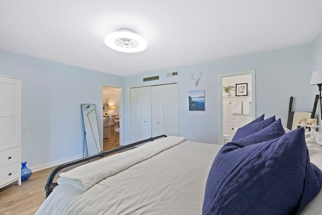 28 Toxaway Pt Unit 7, Lake Toxaway, NC 28747 - bedroom with wood finished floors, ensuite bath, and a closet