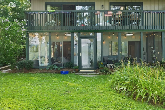 28 Toxaway Pt Unit 7, Lake Toxaway, NC 28747 - rear view of house featuring a balcony and a yard