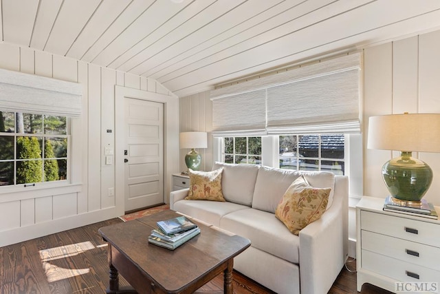 living room featuring vaulted ceiling, dark hardwood / wood-style floors, wooden ceiling, and wood walls