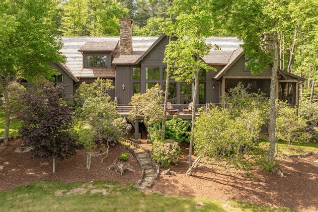 547 Burl Ln, Cashiers, NC 28717 - rear view of house with a chimney and a wooden deck