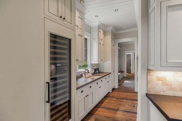 547 Burl Ln, Cashiers, NC 28717 - bar featuring ornamental molding, dark wood finished floors, beverage cooler, decorative backsplash, and recessed lighting