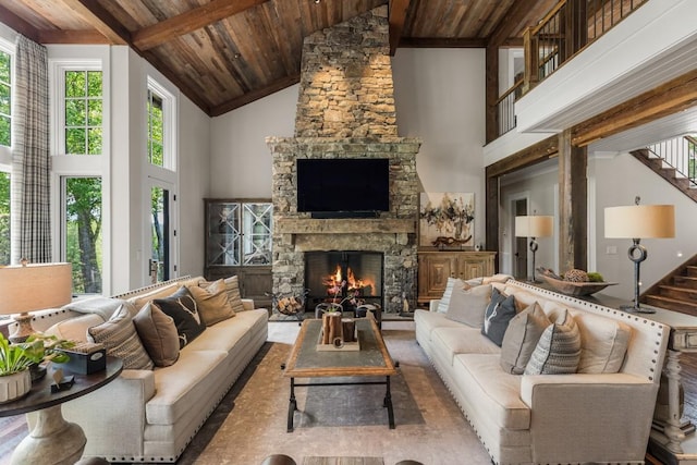 547 Burl Ln, Cashiers, NC 28717 - living room featuring wood ceiling with exposed beams, high vaulted ceiling, healthy amount of natural light, stairs, and a fireplace