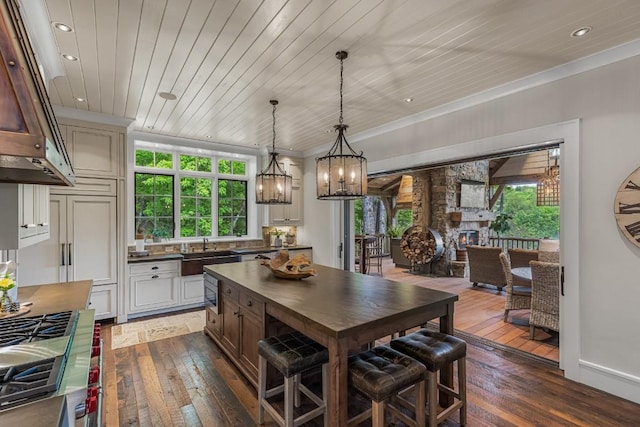 547 Burl Ln, Cashiers, NC 28717 - kitchen with ventilation hood, a sink, dark wood-style floors, a chandelier, and recessed lighting