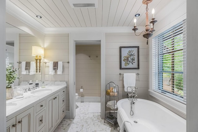 547 Burl Ln, Cashiers, NC 28717 - full bath with a freestanding tub, double vanity, healthy amount of natural light, crown molding, and toilet