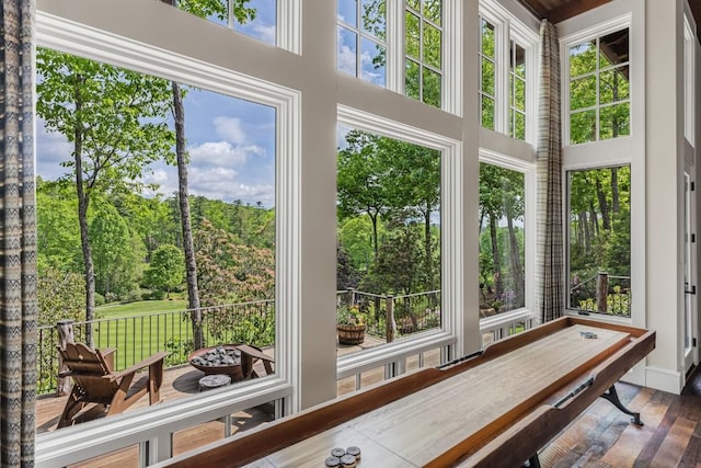 547 Burl Ln, Cashiers, NC 28717 - sunroom featuring wood finished floors, healthy amount of natural light, and a high ceiling