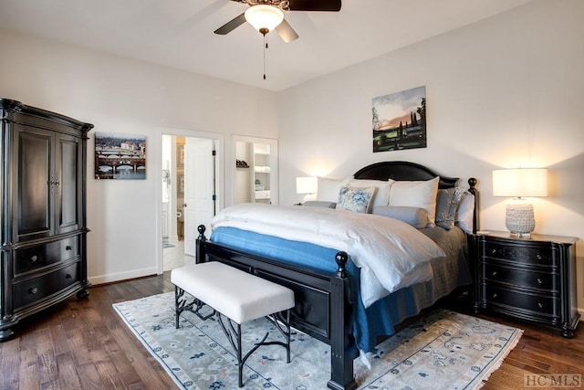 bedroom with ceiling fan, ensuite bath, and dark hardwood / wood-style flooring