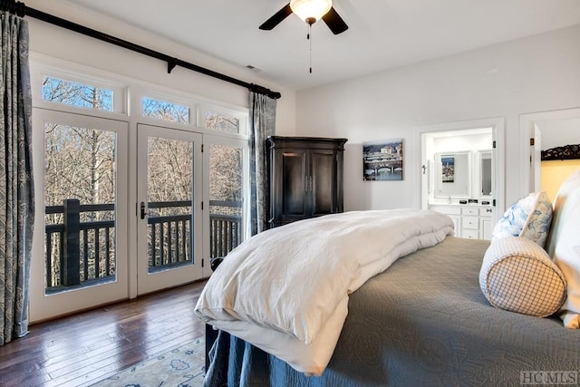 bedroom with ceiling fan, dark wood-type flooring, access to outside, and ensuite bathroom