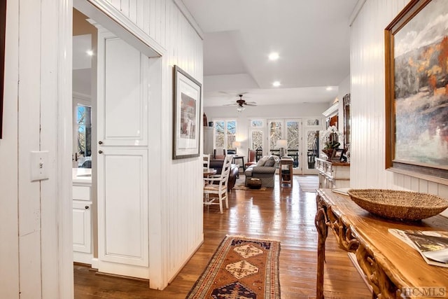 hallway with dark hardwood / wood-style flooring