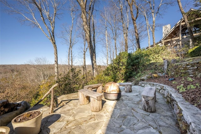 view of patio with an outdoor fire pit