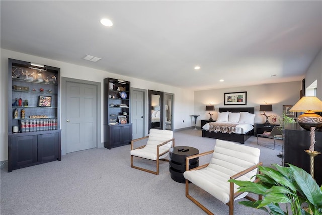 bedroom featuring recessed lighting, visible vents, light colored carpet, and baseboards