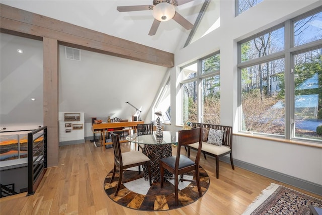 interior space with visible vents, ceiling fan, and vaulted ceiling with beams