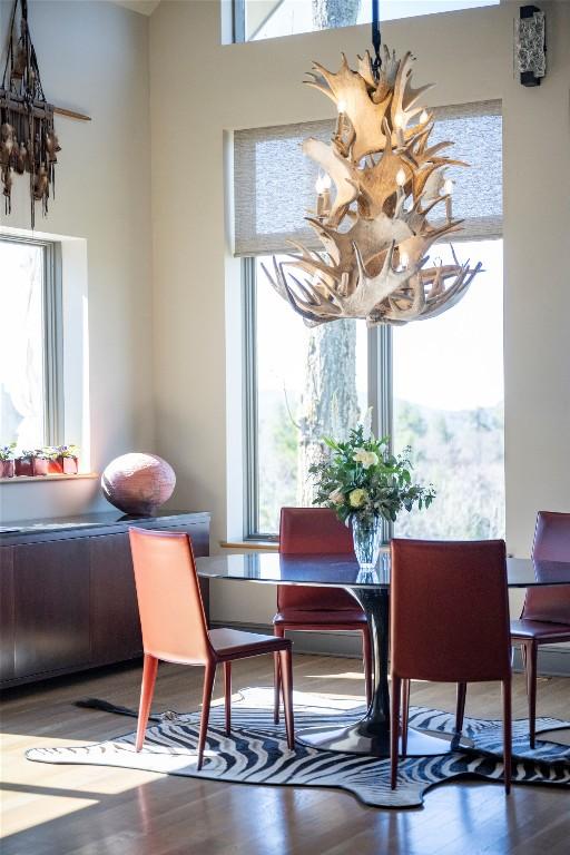 dining space with wood finished floors