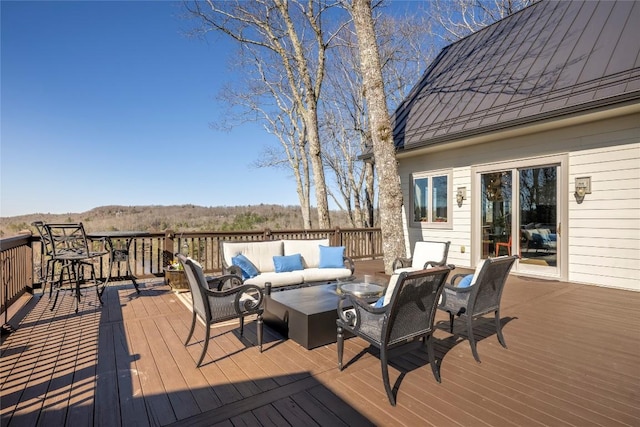 wooden terrace featuring an outdoor living space