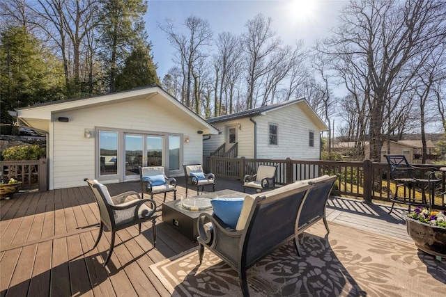 wooden deck featuring an outdoor living space