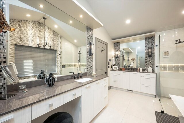 bathroom featuring recessed lighting, a shower stall, tile patterned flooring, lofted ceiling, and vanity