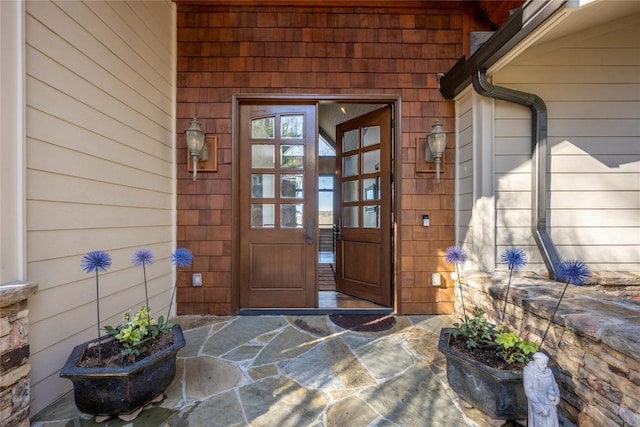 doorway to property featuring a porch