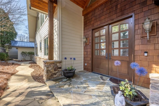 doorway to property with french doors and stone siding