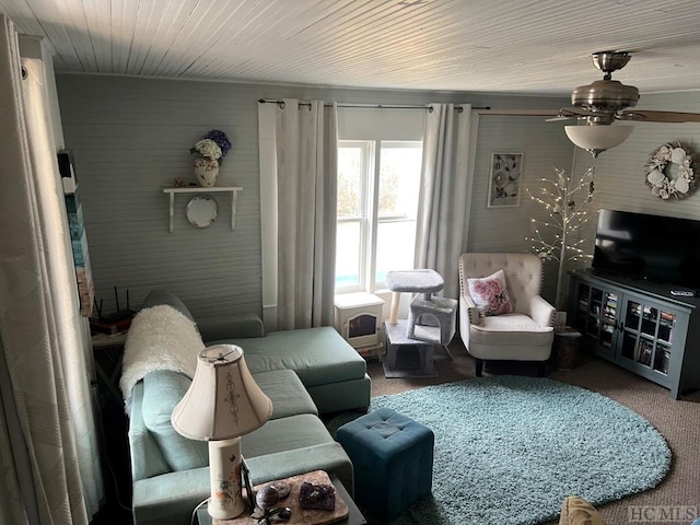 living room with carpet floors and ceiling fan