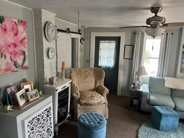 carpeted bedroom featuring wood ceiling and a barn door