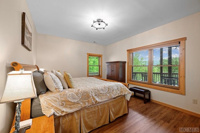 bedroom featuring dark wood-type flooring