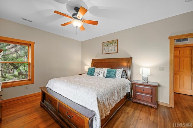 bedroom featuring wood-type flooring and ceiling fan