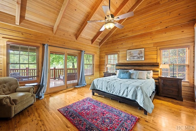 bedroom featuring wood walls, wooden ceiling, light wood-type flooring, access to outside, and beamed ceiling