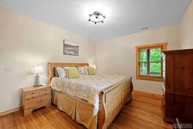 bedroom with light hardwood / wood-style floors