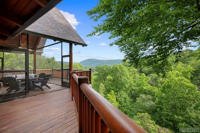 wooden terrace featuring outdoor lounge area and a mountain view