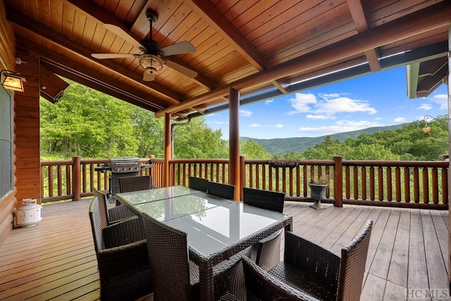 deck featuring ceiling fan and a mountain view