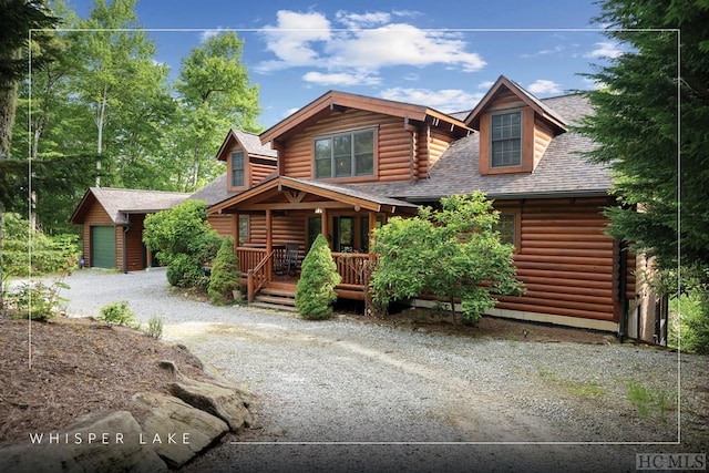 log cabin with a porch