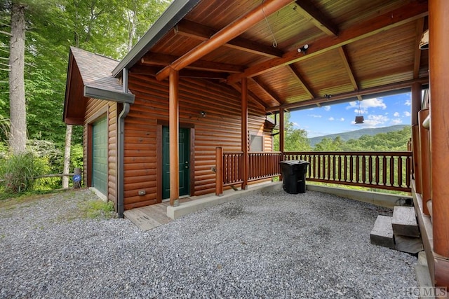 exterior space with a garage and a mountain view