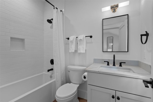 bathroom featuring shower / bath combo with shower curtain, toilet, and vanity