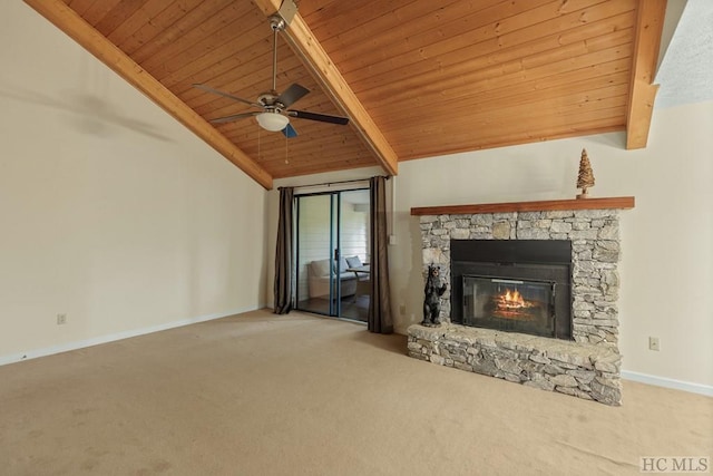 unfurnished living room featuring light carpet, wood ceiling, a stone fireplace, and lofted ceiling with beams