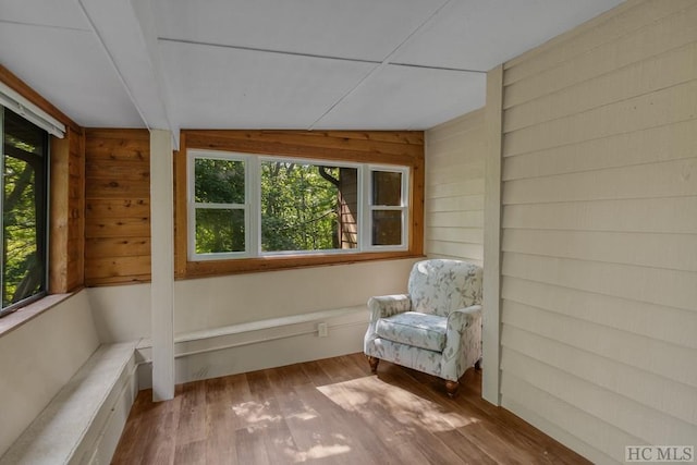 unfurnished sunroom with lofted ceiling